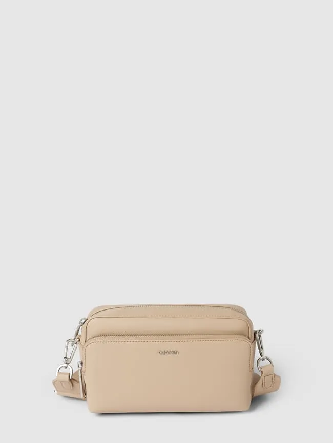 Handbag with label and adjustable shoulder strap Calvin Klein, beige